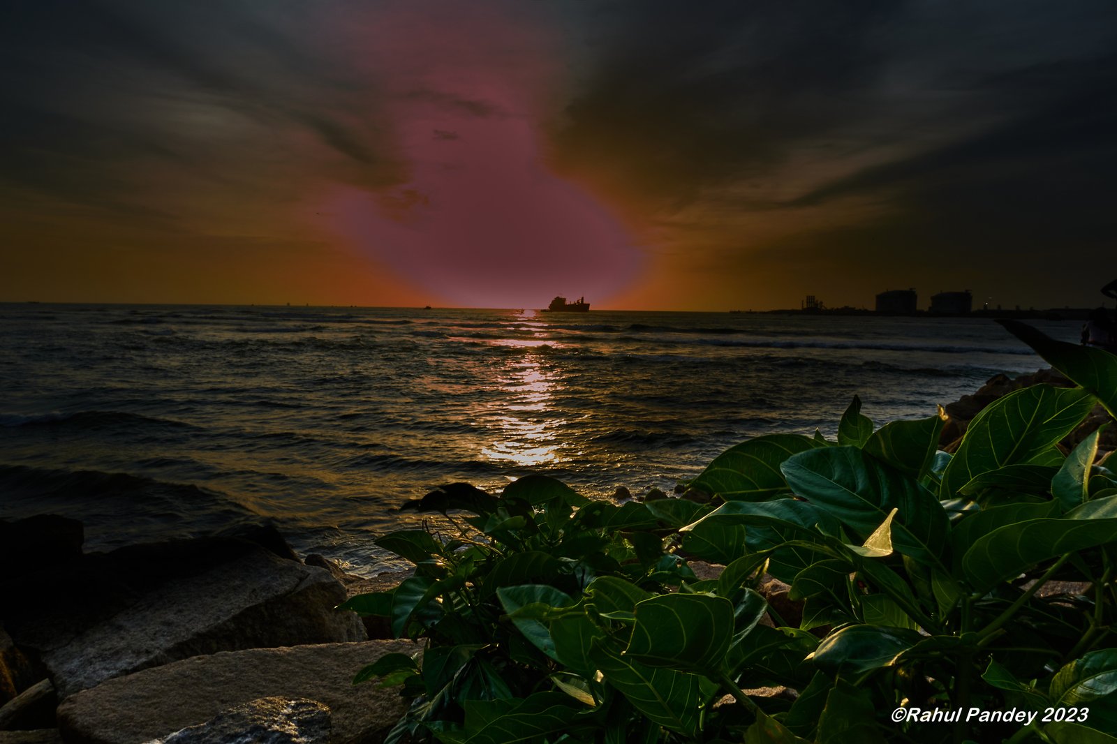 Setting Sun hiding behind clouds at Fort Kochi Beach