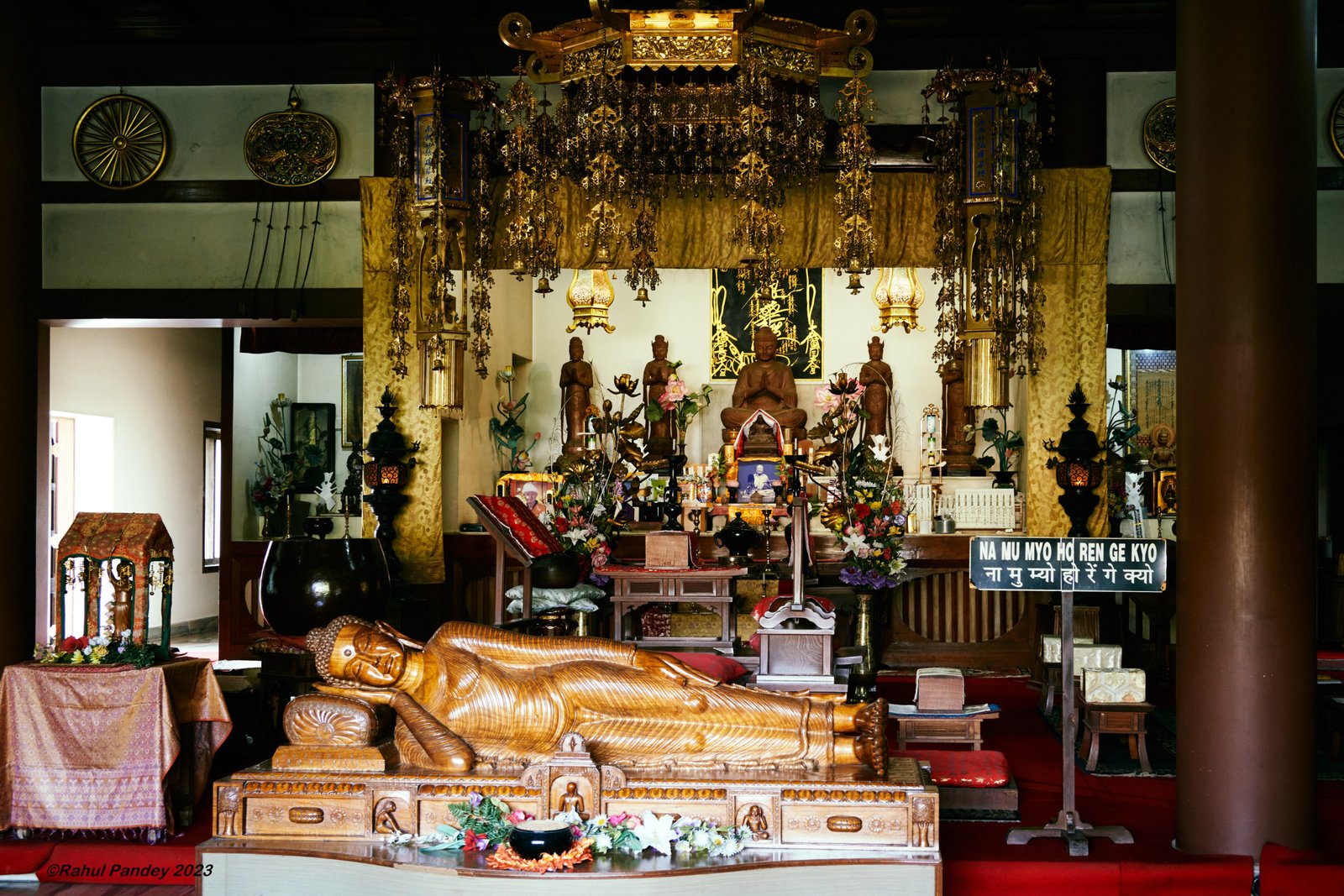 Wooden statue of the Buddha in reclining pose, Japanese Temple - Sarnath